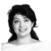 Smiling portrait of IELTS coach and educator Shadi Khosravi against a neutral background